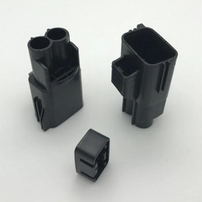 Black custom molded plastic housing components